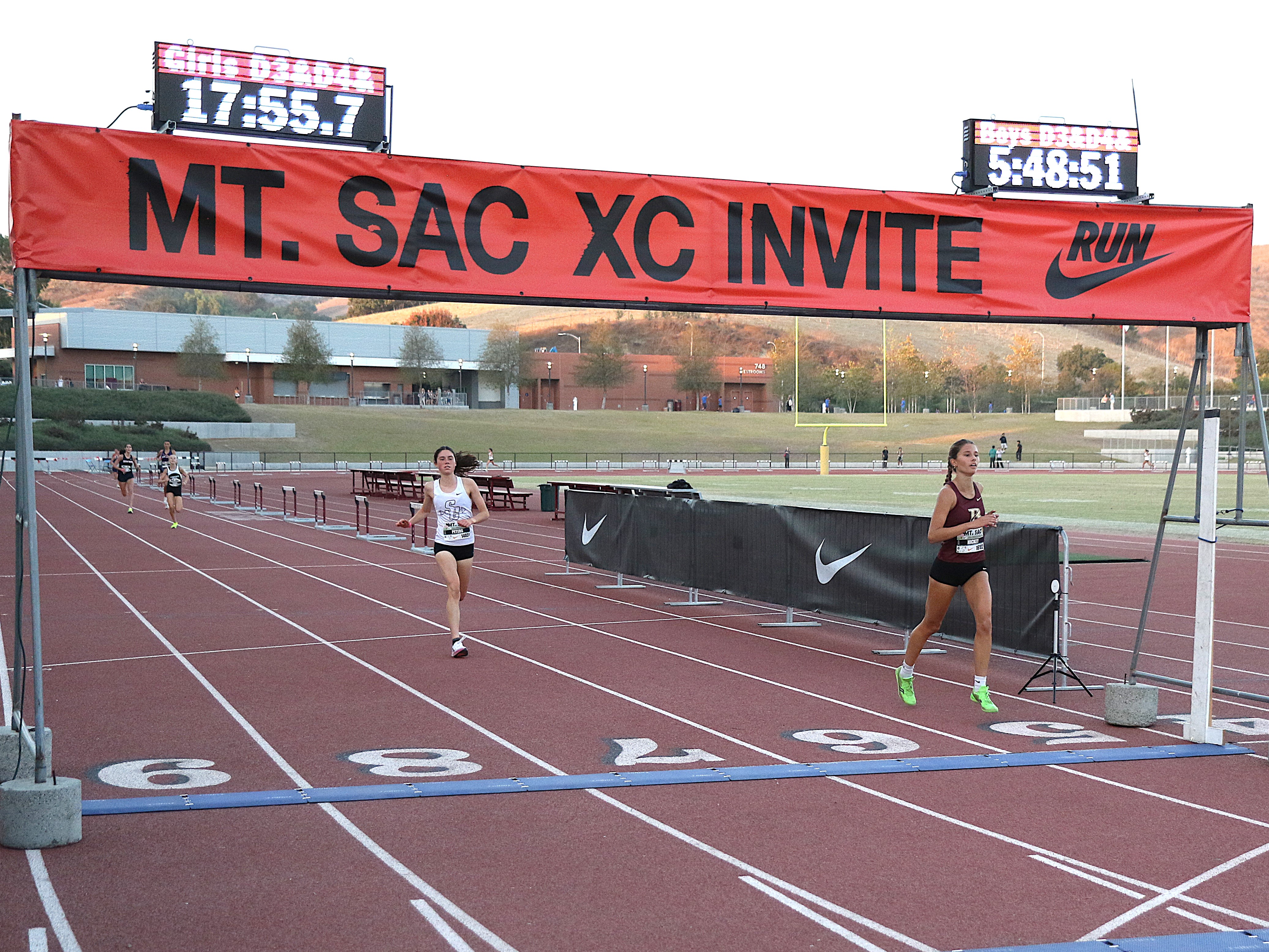 Ayanna Hickey and Gabriella Peters finish line